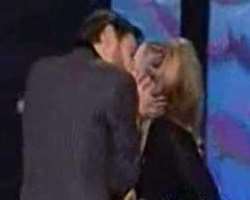 Jim Carrey grabbed and smooched her when she presented him MTV Movie Awards for the Best Comedic Performance. He apologized for his behavior afterward